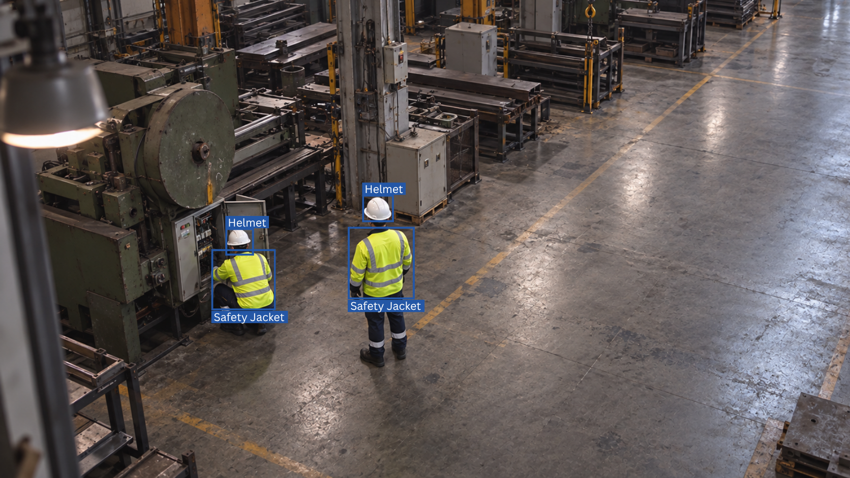 Factory staff wearing safety helmets, high-visibility jackets, gloves, and safety boots